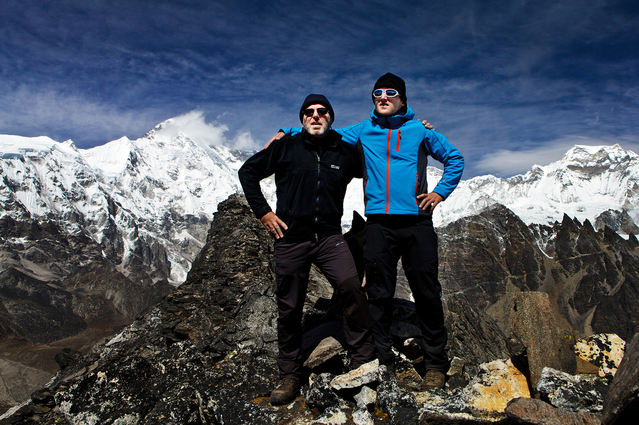 My father and I on top of the Ngozumpa Tse, 5540 MAMSL. Background - Cho Oyu south wall, 8201 MAMSL.