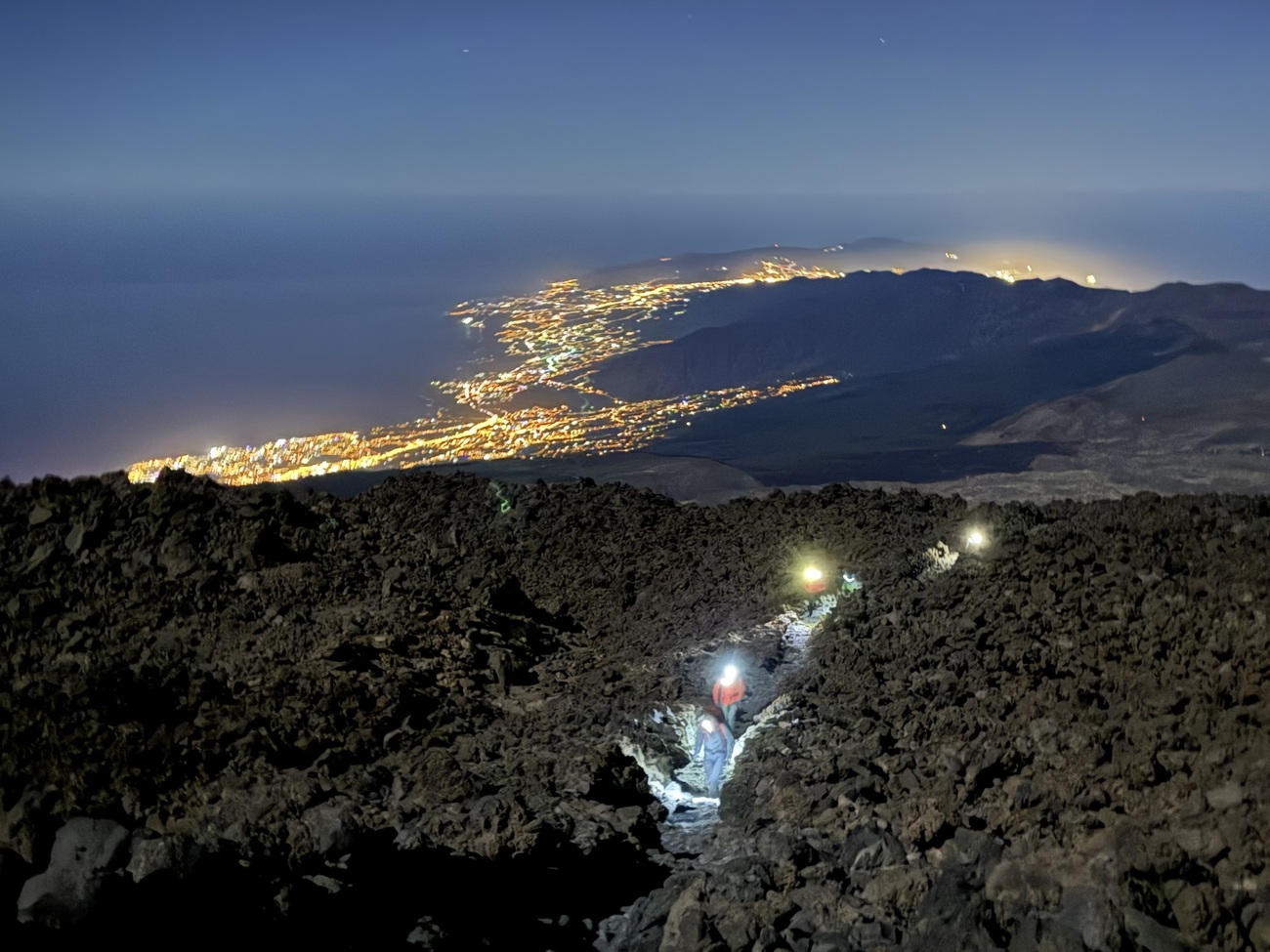 People with handlamps on the ascent of Teide, Tenerife, Canary Islands.